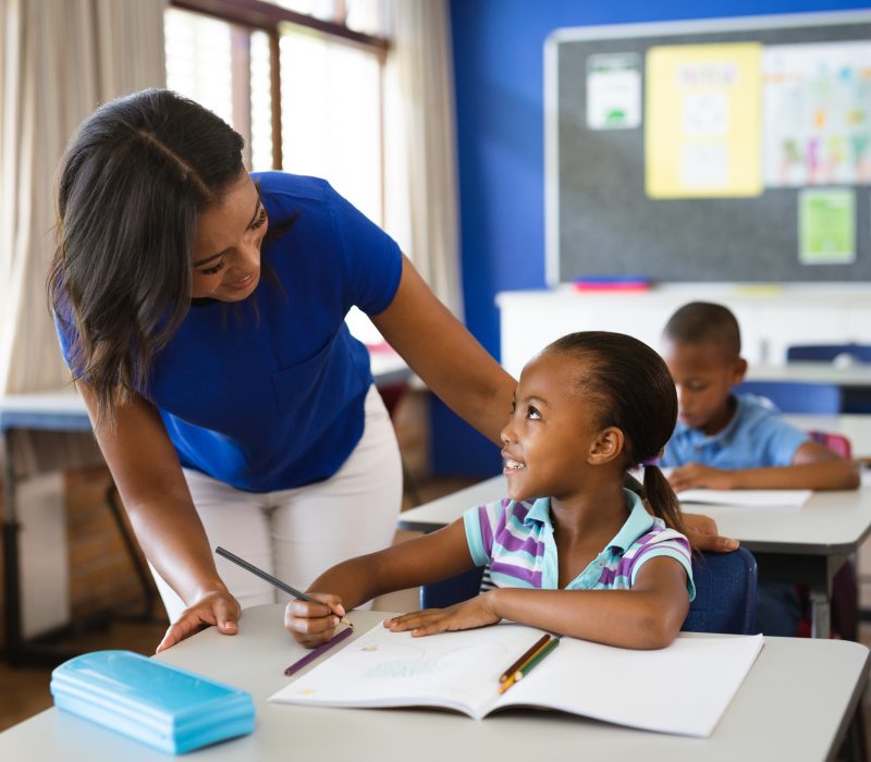 African american female teacher teaching african american girl i